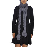 Woman wearing plait knitted scarf and black dress from Autumn Winter Oversized Long Plait Knitted Scarf - Plain & Chic.