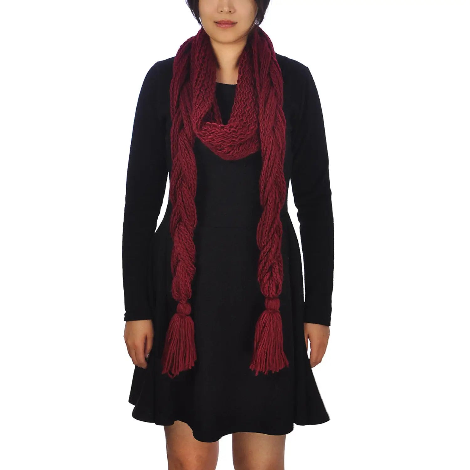 Fashionable woman in black dress and red plait knitted scarf