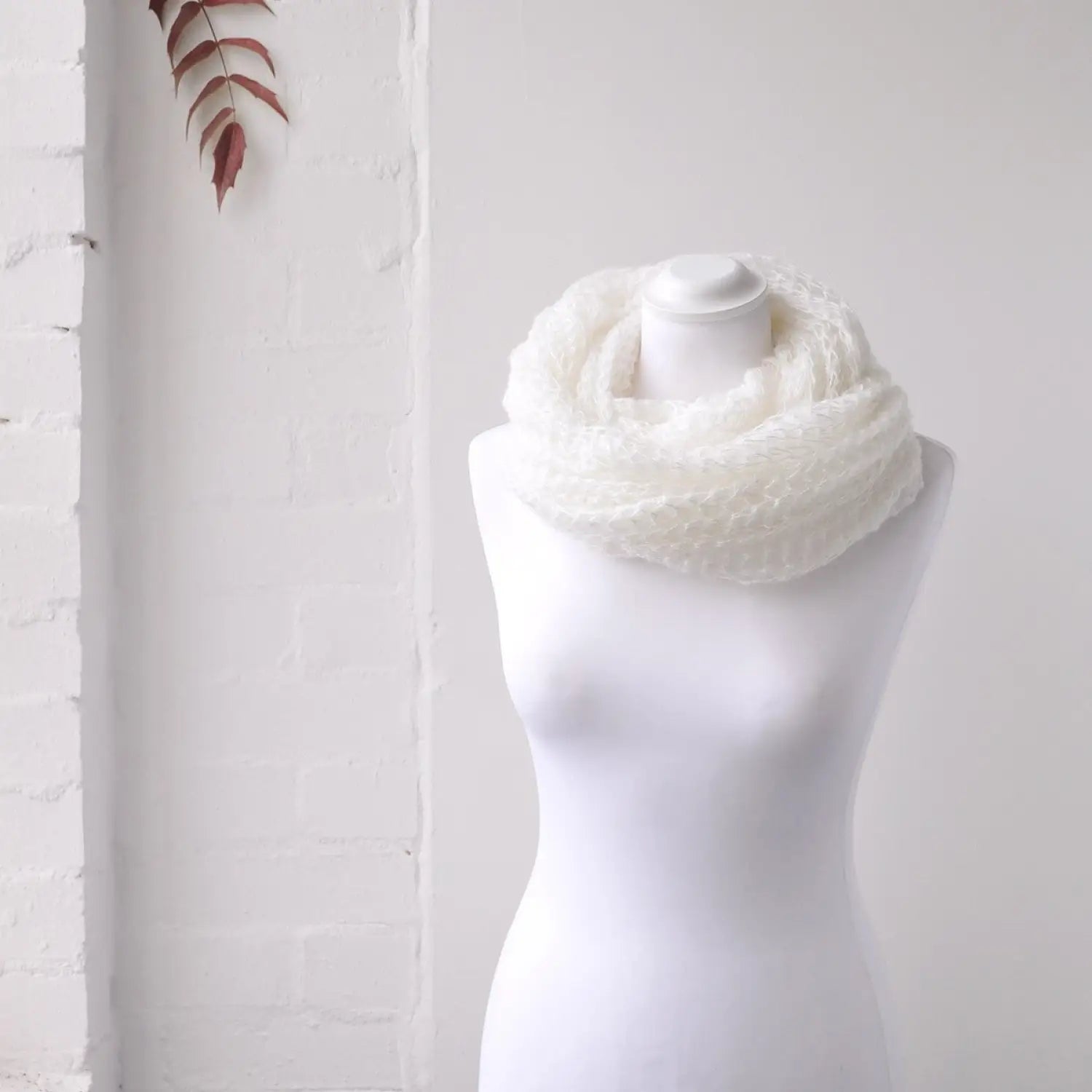 Soft knitted white scarf on man displayed in Autumn Winter Snood Scarf product.