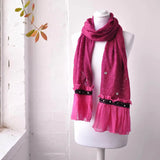 Bohemian Retro Ruffle Winter Knitted Frilled Maxi Scarf on mannequin with pink scarf and black ribbon