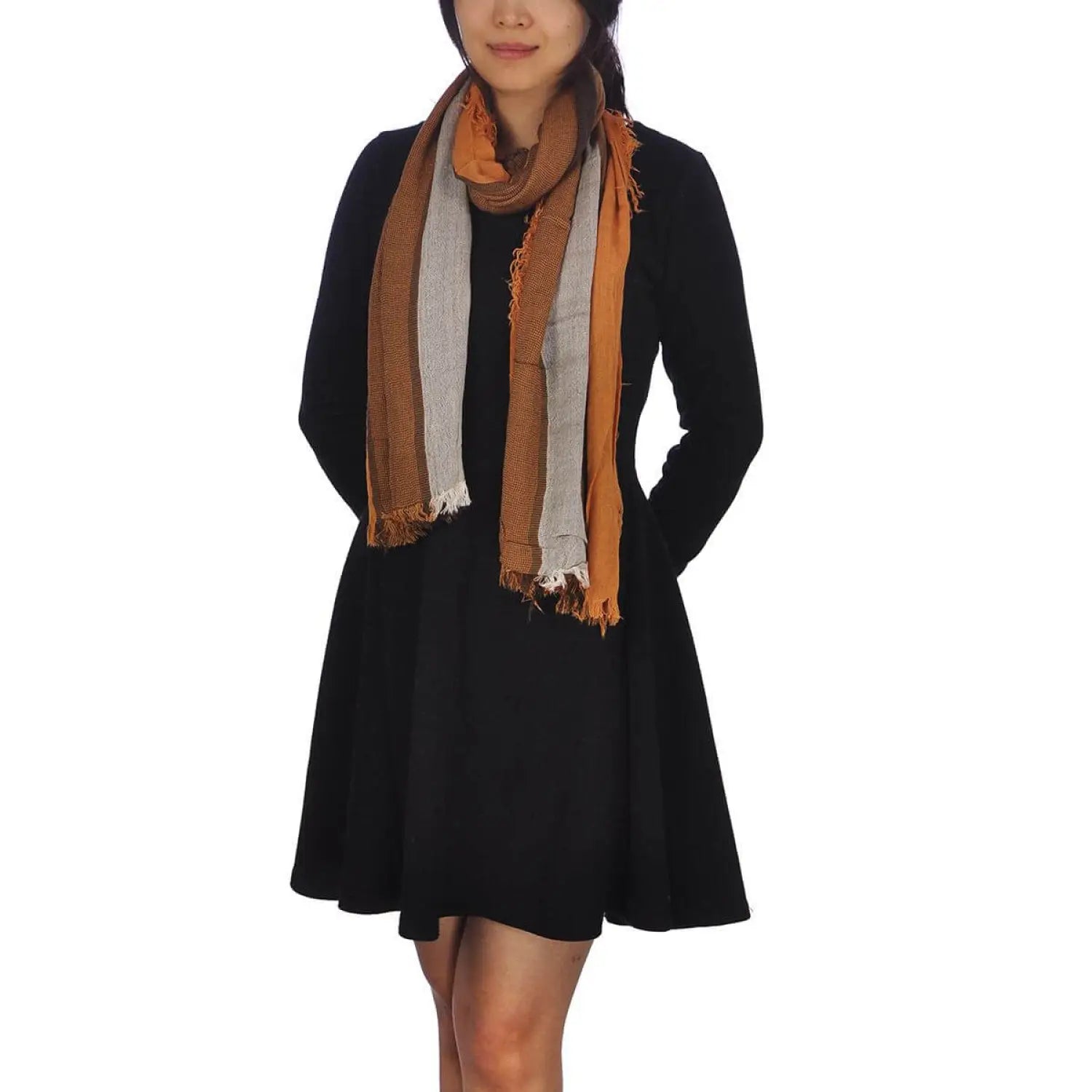 Woman wearing black coat and tan scarf for Bold Multicoloured Striped Scarf with Frayed Edges