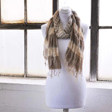 Bold striped crinkled scarf on mannequin by window