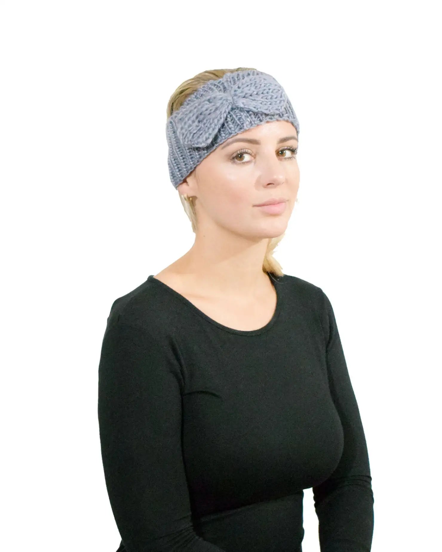 Woman wearing a bow-detailed knitted headband from Autumn & Winter collection.