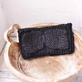 Bow-Detailed Knitted Headband displayed on wooden bowl