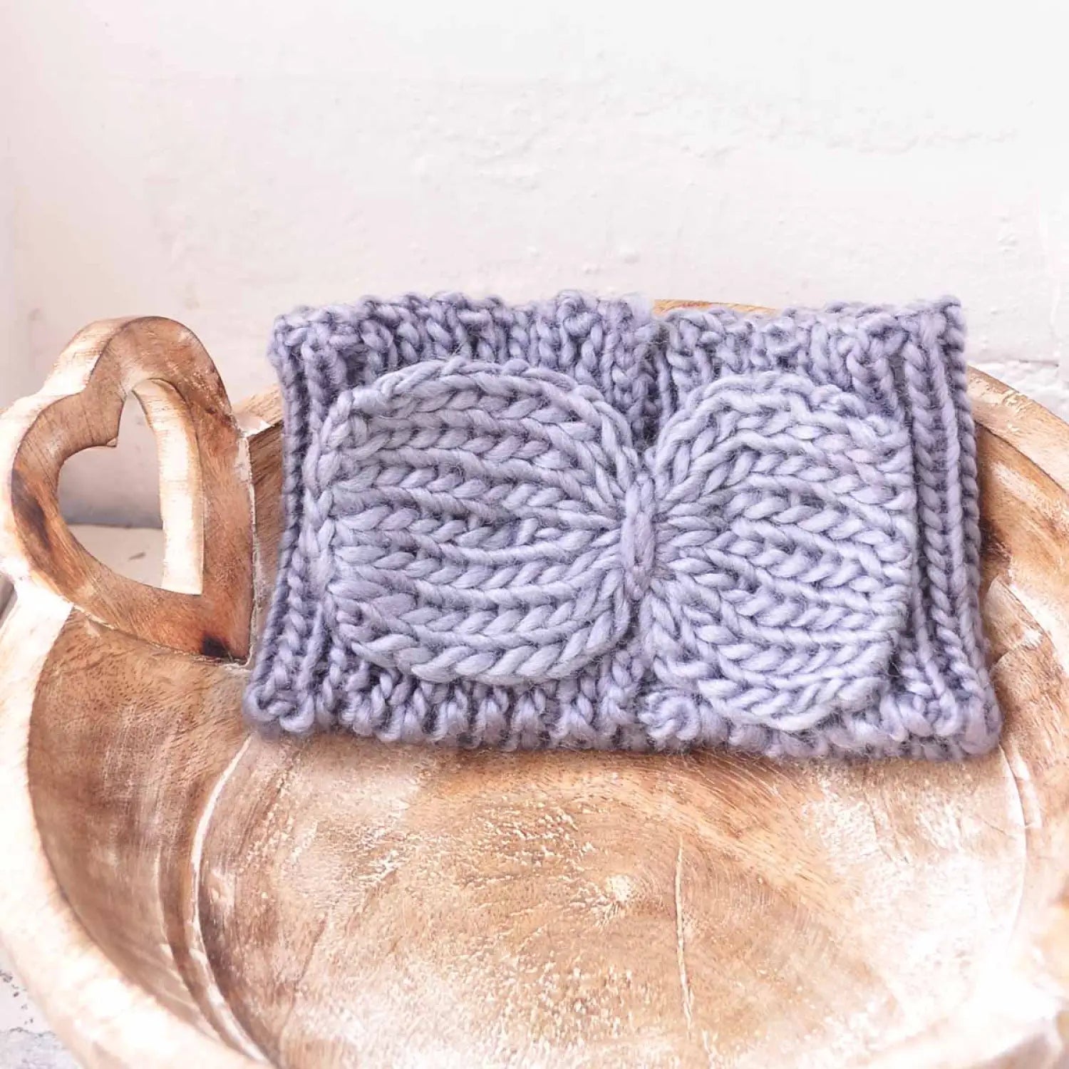 Knitted dishcloth with blue detail, displayed in Bow-Detailed Knitted Headband for Autumn & Winter.