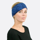 Woman wearing blue headband with bow detail - Bow-Detailed Knitted Headband.