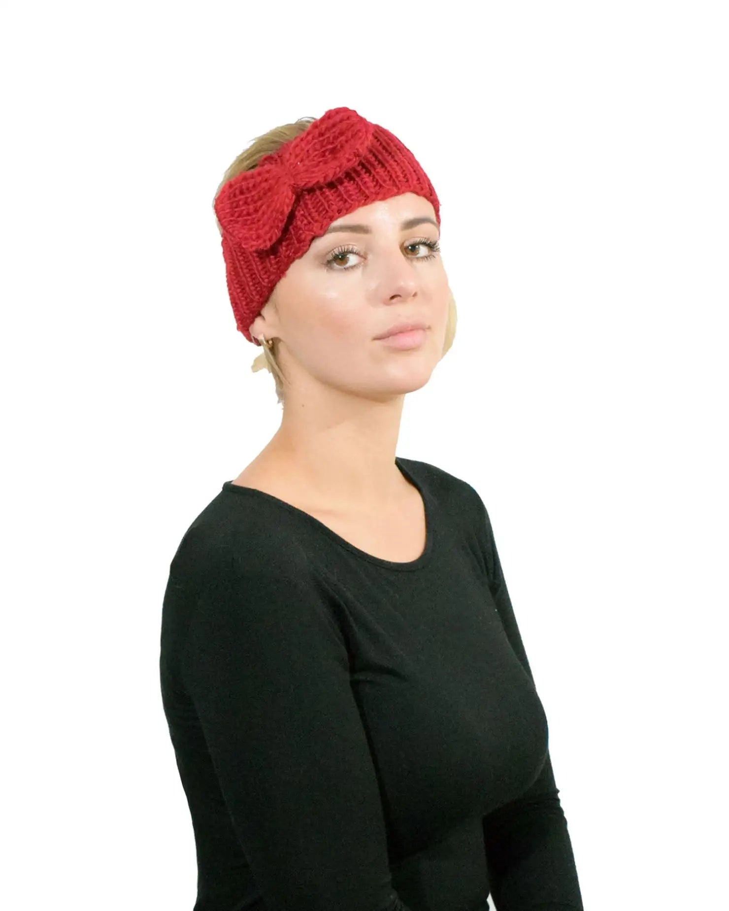 Woman wearing a red bow detailed knitted headband for Autumn & Winter
