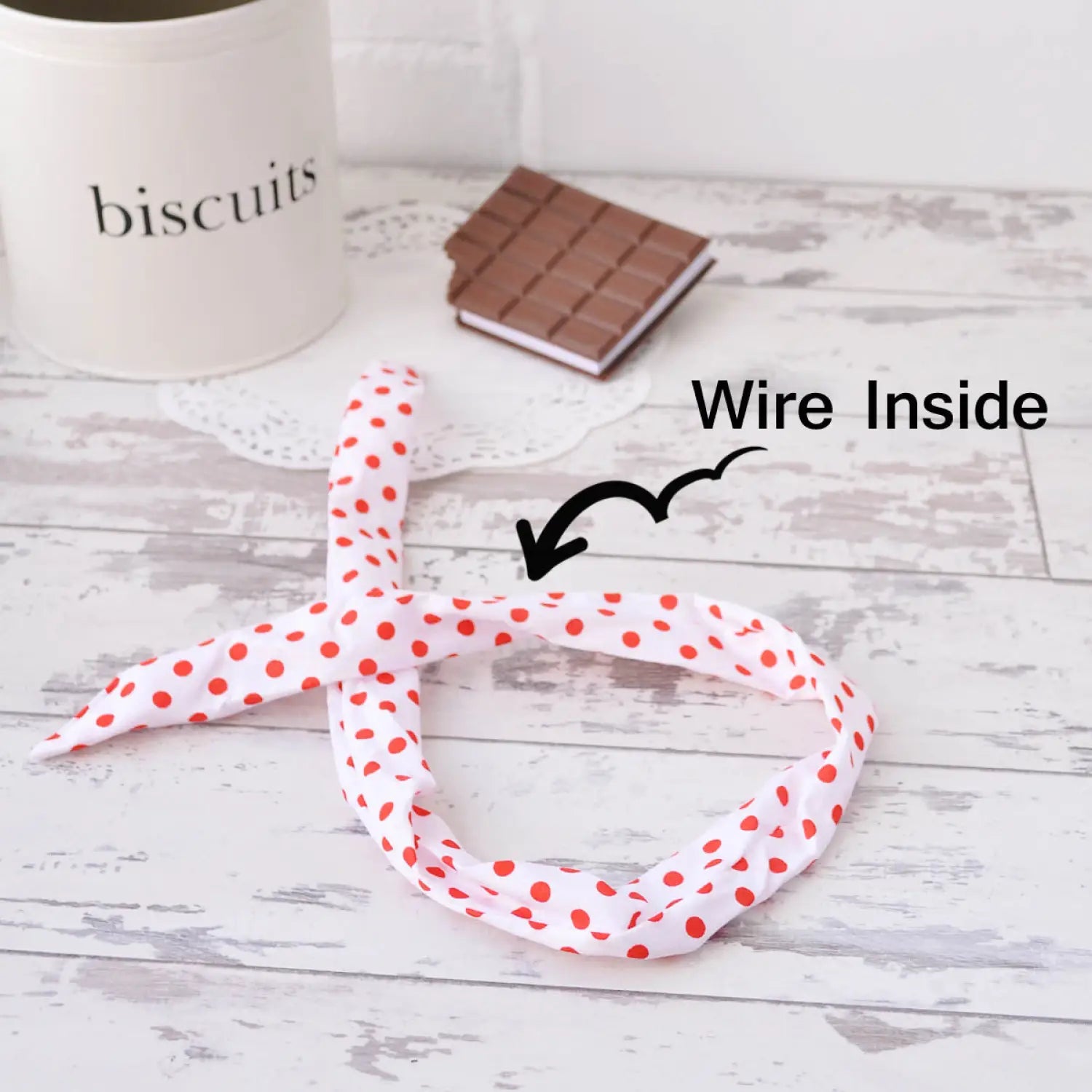 White table with coffee cup, red polka dot ribbon, Bunny Ears Retro Polka Dot Wire Headband.