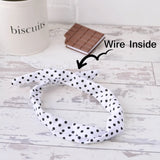 White and black polka dot headband with bunny ears referenced as retro polka dot wire headband