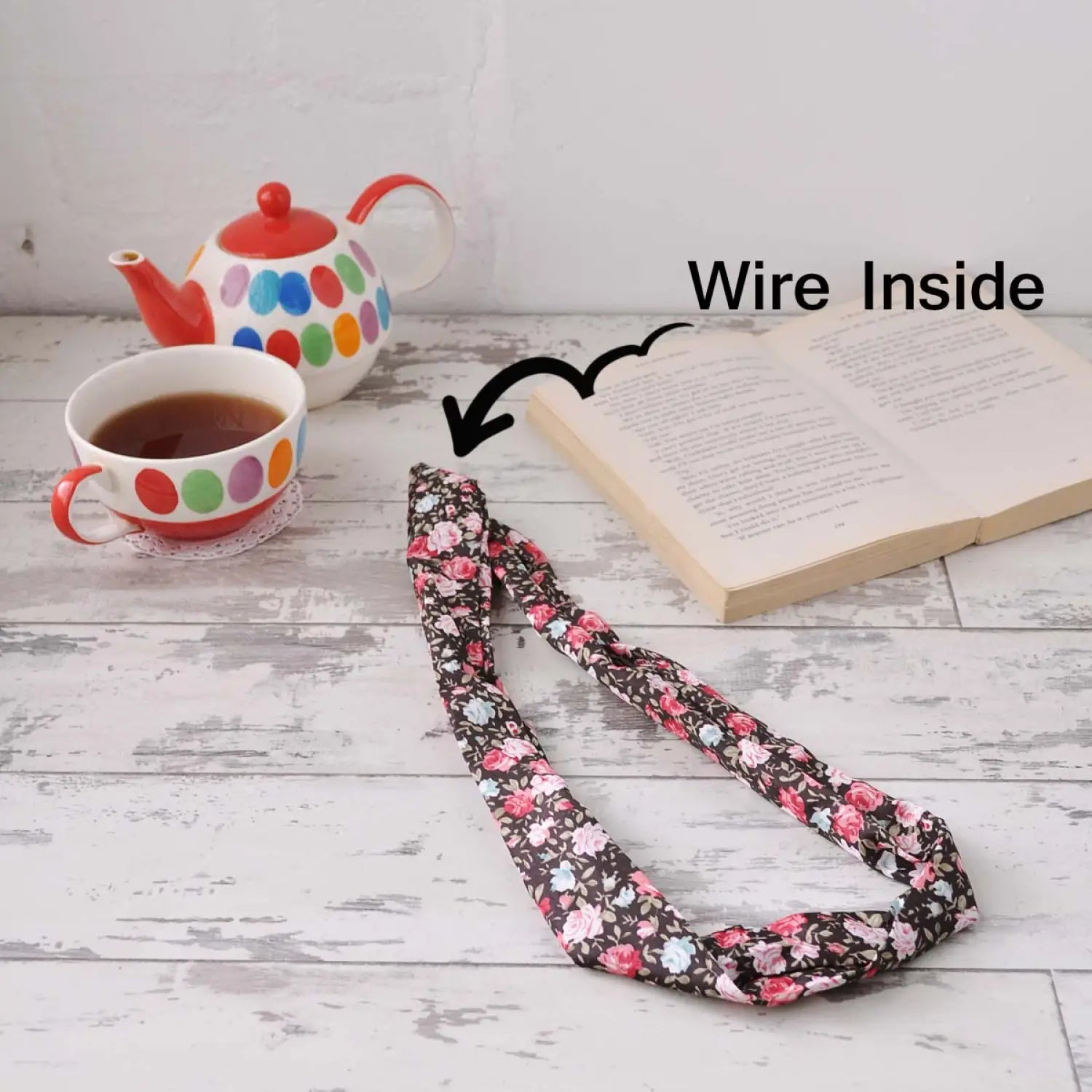 Bunny Ears Retro Rose Print Wire Headband set with book and cup on table
