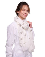 Woman in white scarf with grey butterfly print