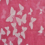 Butterfly print oversized shawl with pink background and white butterflies.