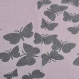 Butterfly print oversized shawl wrap for women on pink background with black butterflies