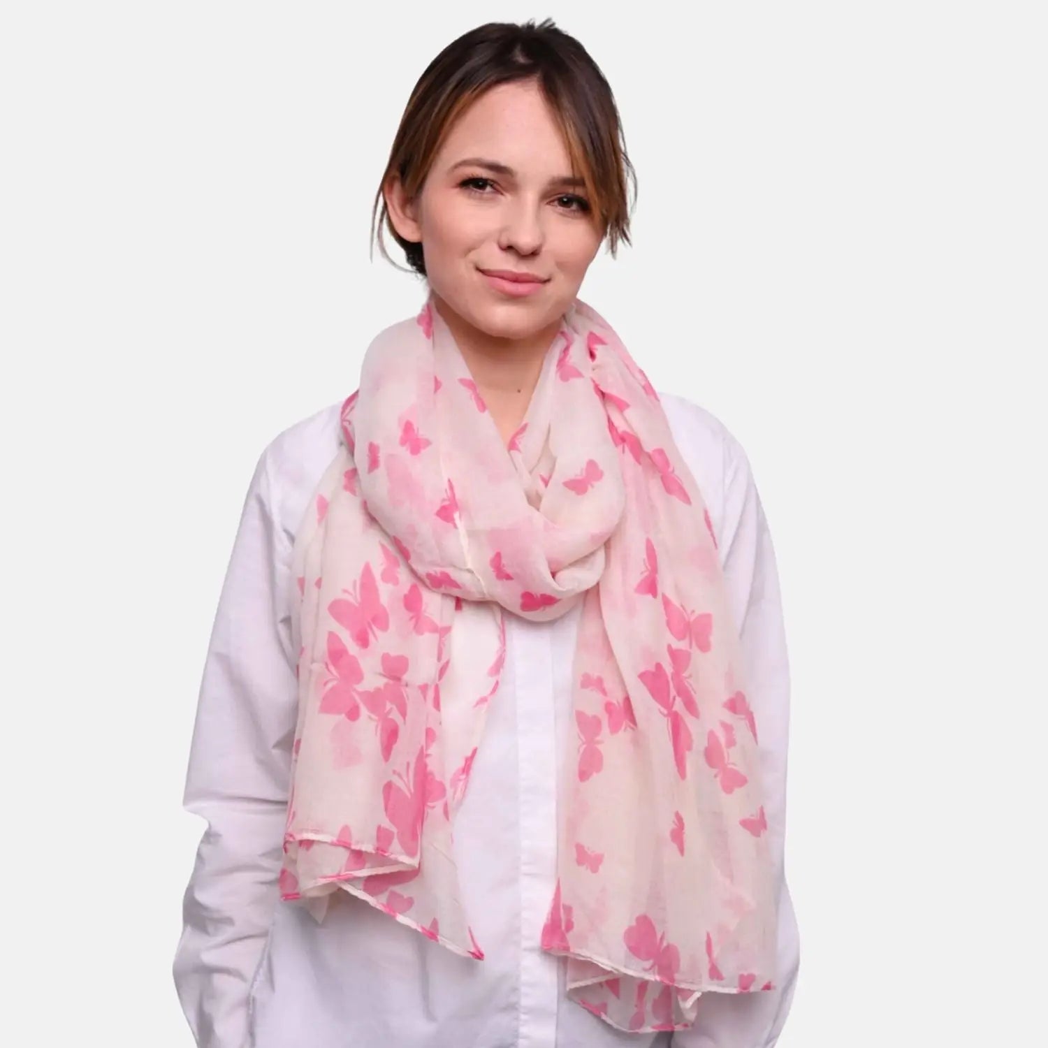 Woman wearing pink butterfly print oversized viscose shawl wrap.