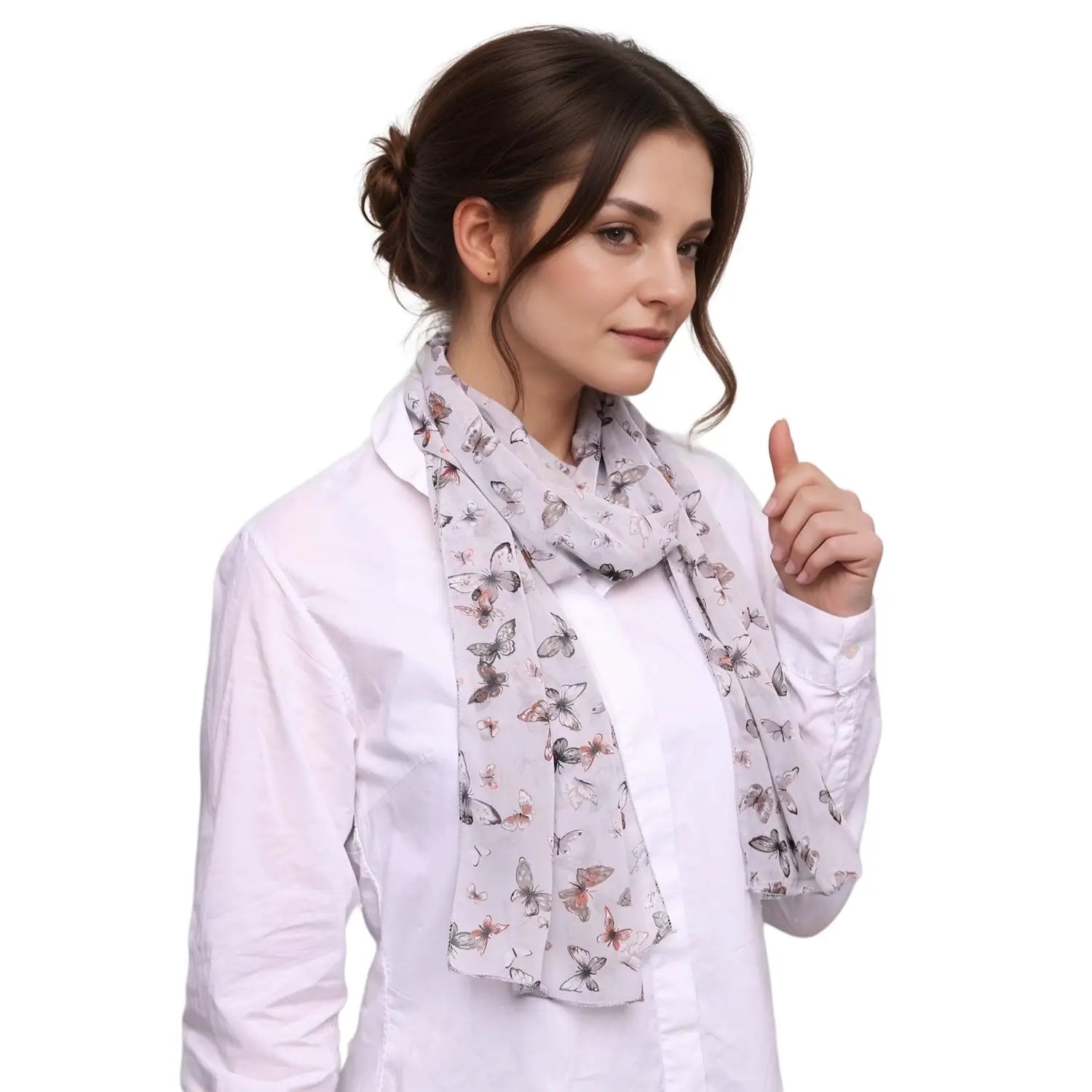 Butterfly print scarf elegantly styled over a white shirt for a chic look