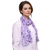 Lavender butterfly print scarf styled over a white shirt for a chic look