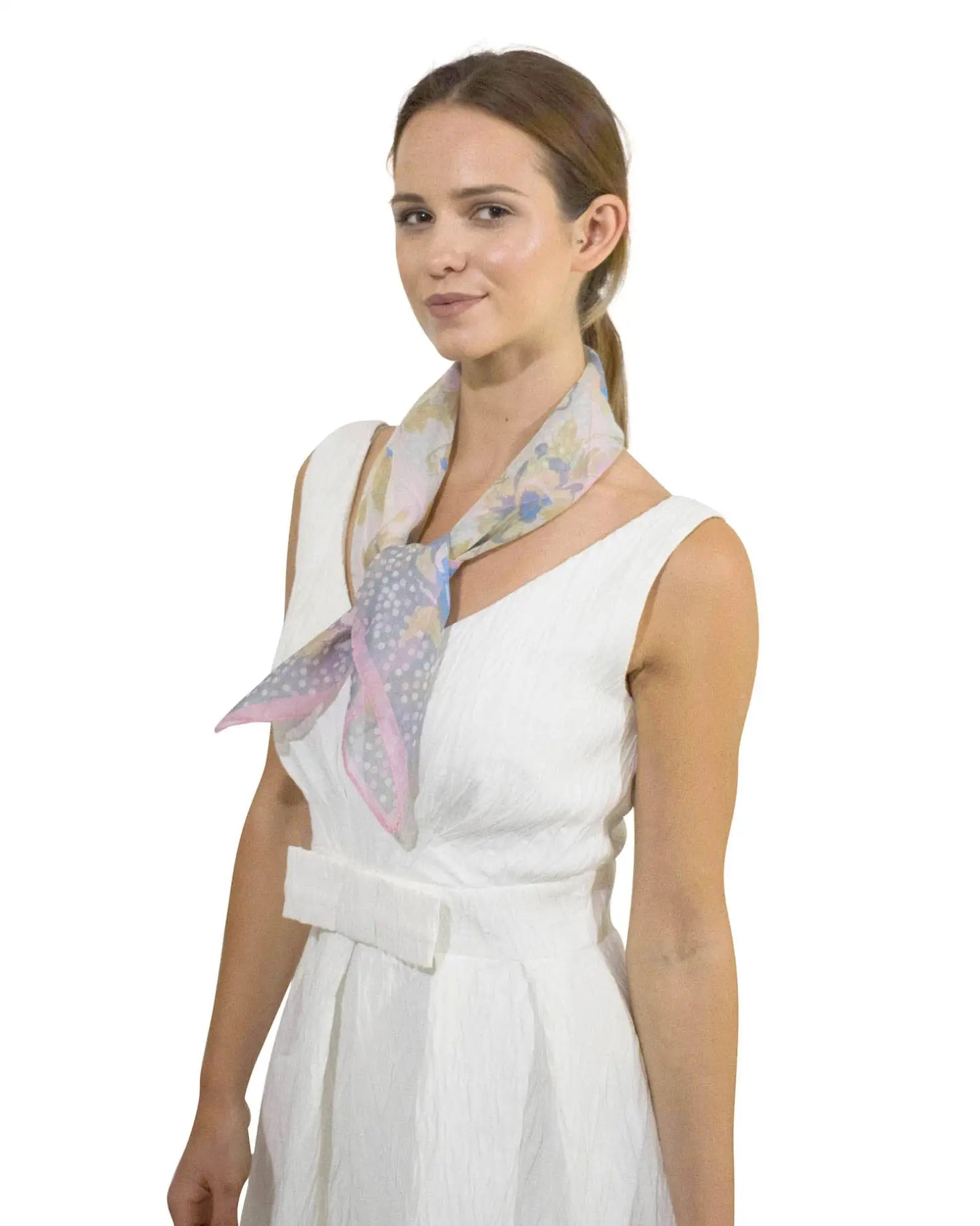 Woman in white dress and pink scarf modeled with Charming Polka Dot & Floral Small Square Scarf.