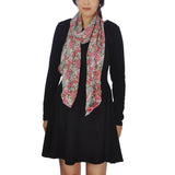 Woman wearing black dress and pink floral scarf from Chic Floral Print Waterfall-Edge Lightweight Chiffon Scarf.