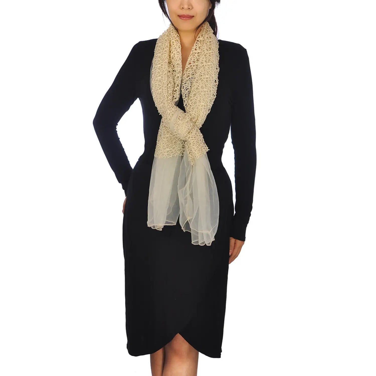 Woman in black dress and chiffon cowl neck scarf with rope detailing.