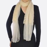 Woman wearing white chiffon cowl neck scarf with lace edge and unique rope detailing