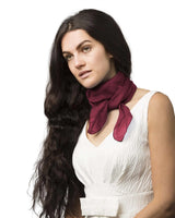 Woman wearing white dress and maroon chiffon square scarf for women