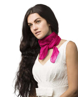 Woman wearing a pink chiffon square scarf