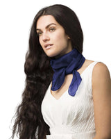 Woman wearing lightweight chiffon square scarf in blue for square neck scarves.