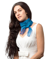 Woman wearing lightweight chiffon square scarf.