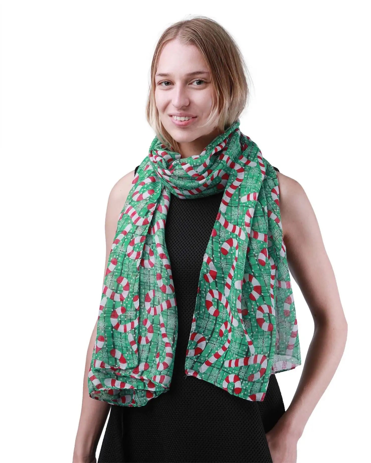 Woman wearing a green Christmas scarf with red and white squares