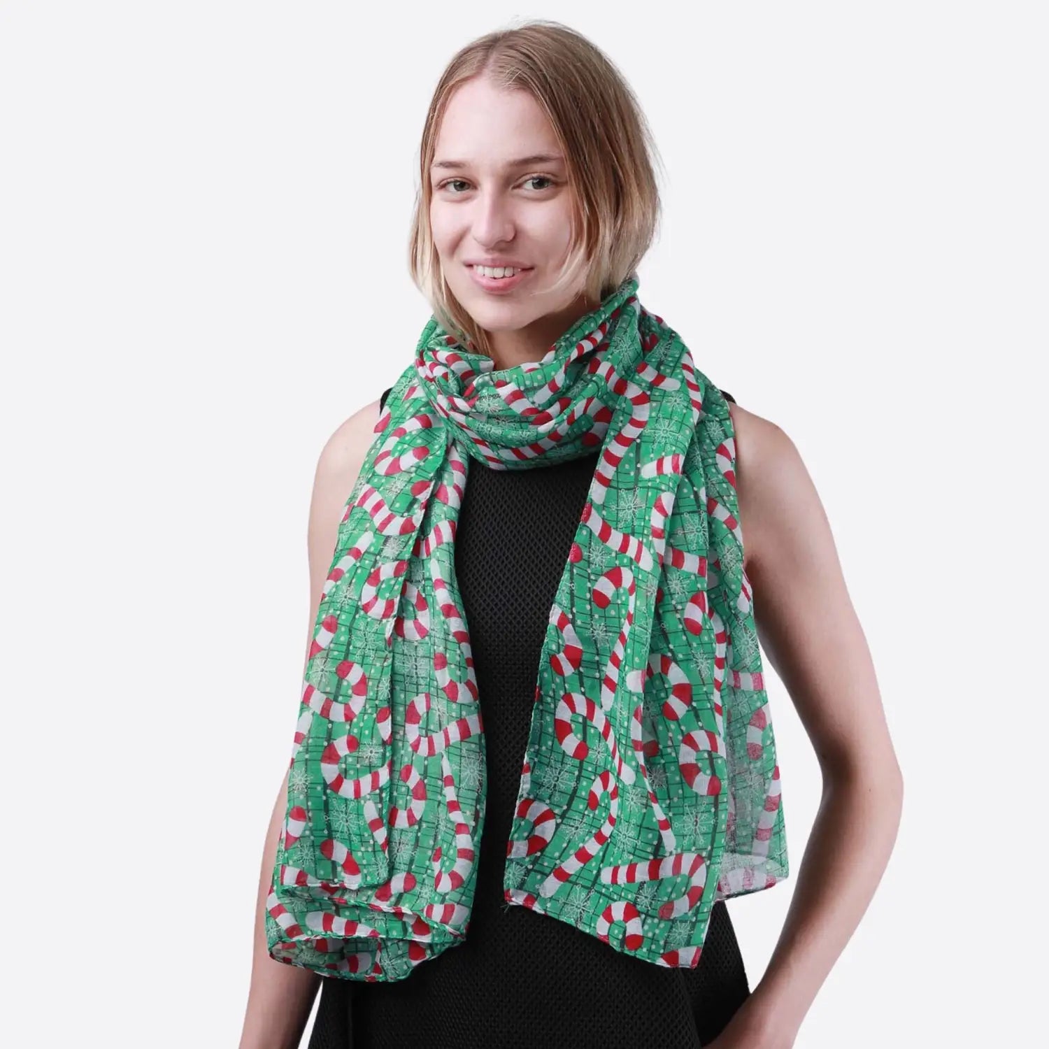 Christmas oversized maxi scarf with green, red, and white squares worn by a woman