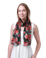 Woman wearing black and red floral scarf representing Christmas Scarf Poinsettia Flower Scarves