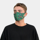 Man wearing a green Christmas face mask from Christmas Tree Copper-Infused Face Mask Covering.