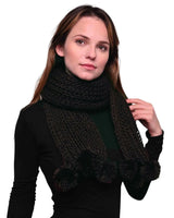 Chunky Knit Winter Scarf with Pom Pom Accents on woman - black scarf and shirt