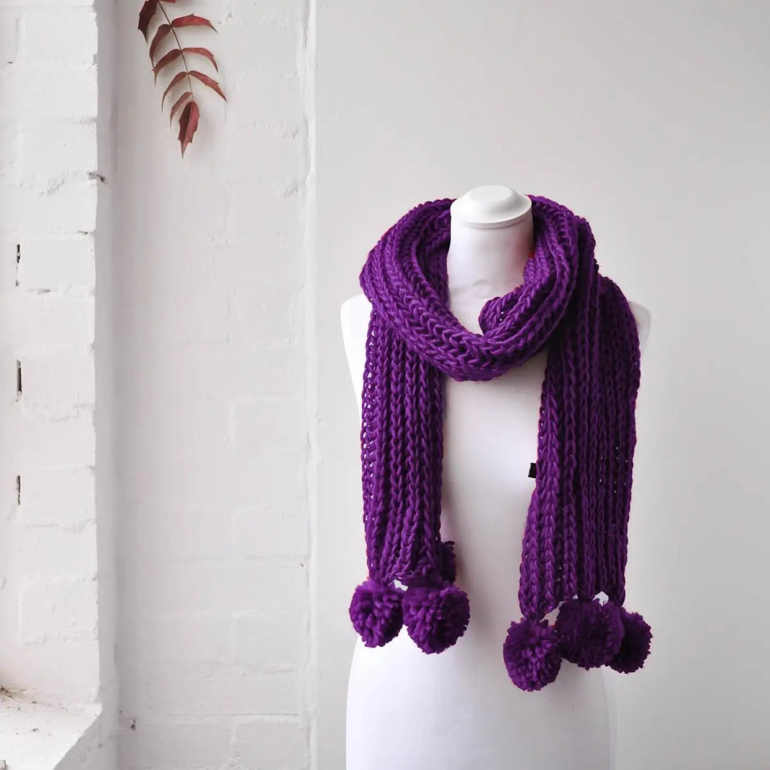 Chunky Knit Winter Scarf with Pom Pom Accents on Mannequin Dummy