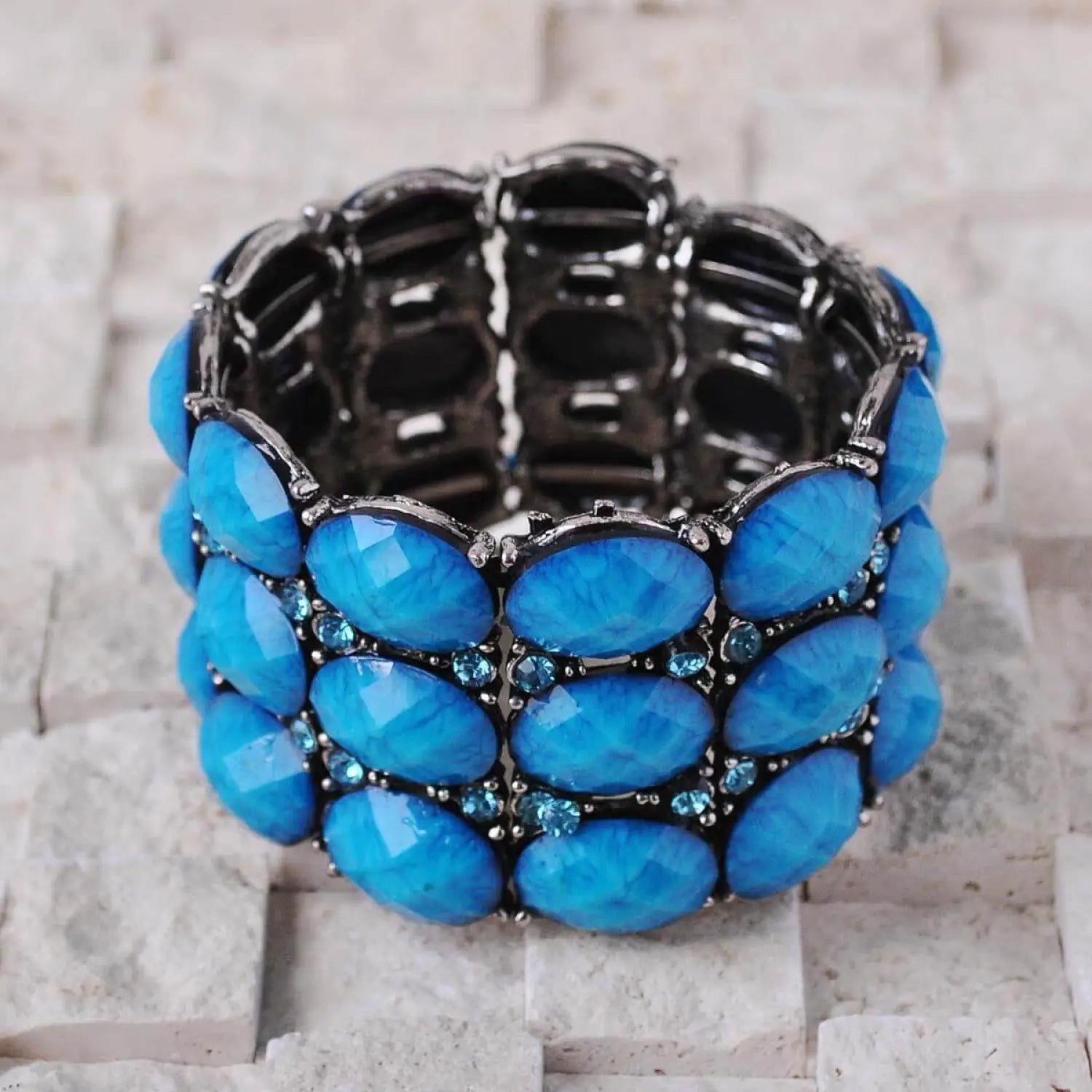 Chunky vivid metal bracelet with black crystals and silver accents