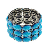 Chunky vivid metal bangle with blue crystals