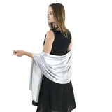 Elegant satin evening shawl draped over woman in black dress