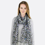 Stylish woman wearing colourful leopard print scarf