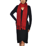 Woman wearing red crinkled cotton scarf with tassels