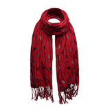 Red scarf with black and grey polka dot hearts.