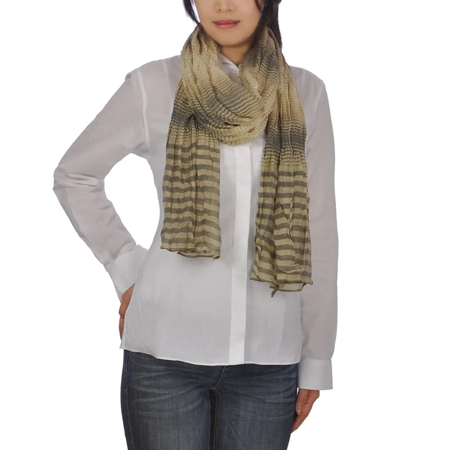 Woman wearing crinkled striped lightweight scarf.