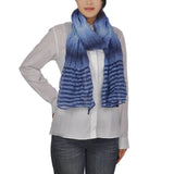 Woman in blue and white striped lightweight scarf from Crinkled Striped collection.