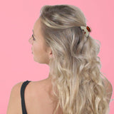 Mini hair claw clips with a woman wearing black top and long blonde hair.