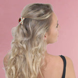 Blonde woman wearing Crystal X Ribbon Mini Hair Claw Clips