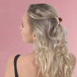 Blonde woman with flower in hair wearing Diamante Crystal Ribbon Mini Hair Claw Clips.