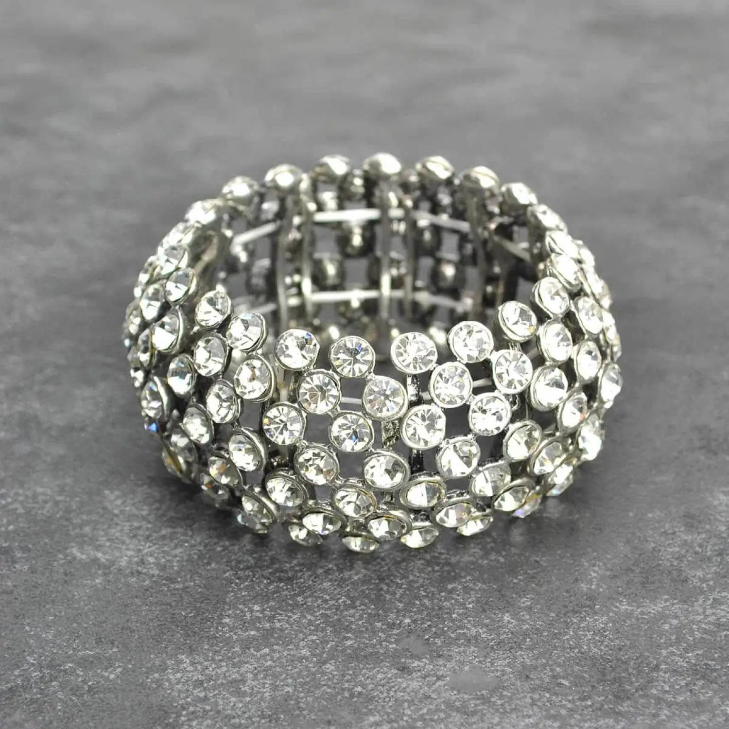 White gold and diamond ring displayed in Diamante Rhinestone Crystal Elasticated Cuff Bracelet