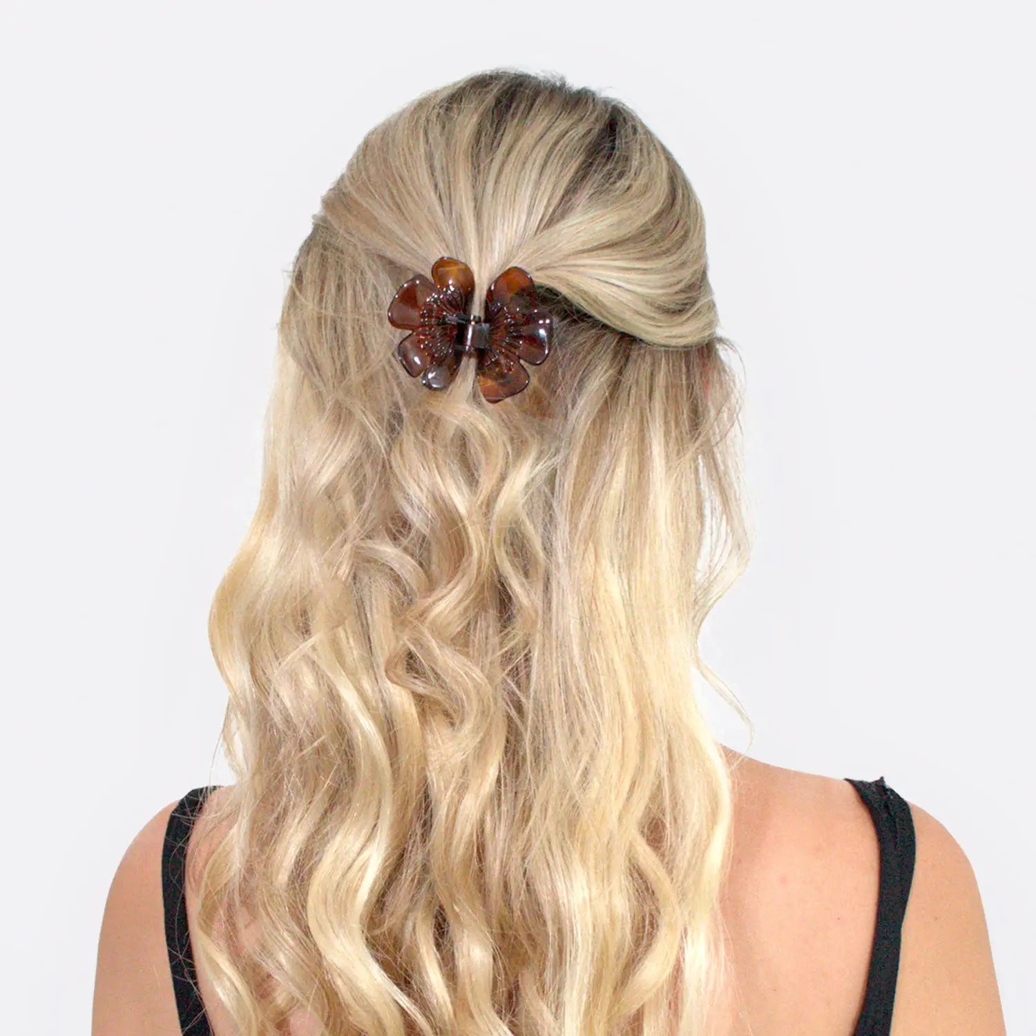 Blonde woman wearing Elegant French Butterfly Flower Hair Claw.