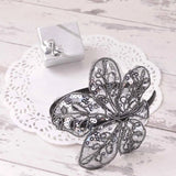 White plate with black and white flower, featured in Elegant Leaf Alice Headband.