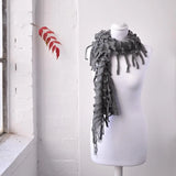 Elegant plain knitted ruffled grey scarf on mannequin for Autumn & Winter warmth