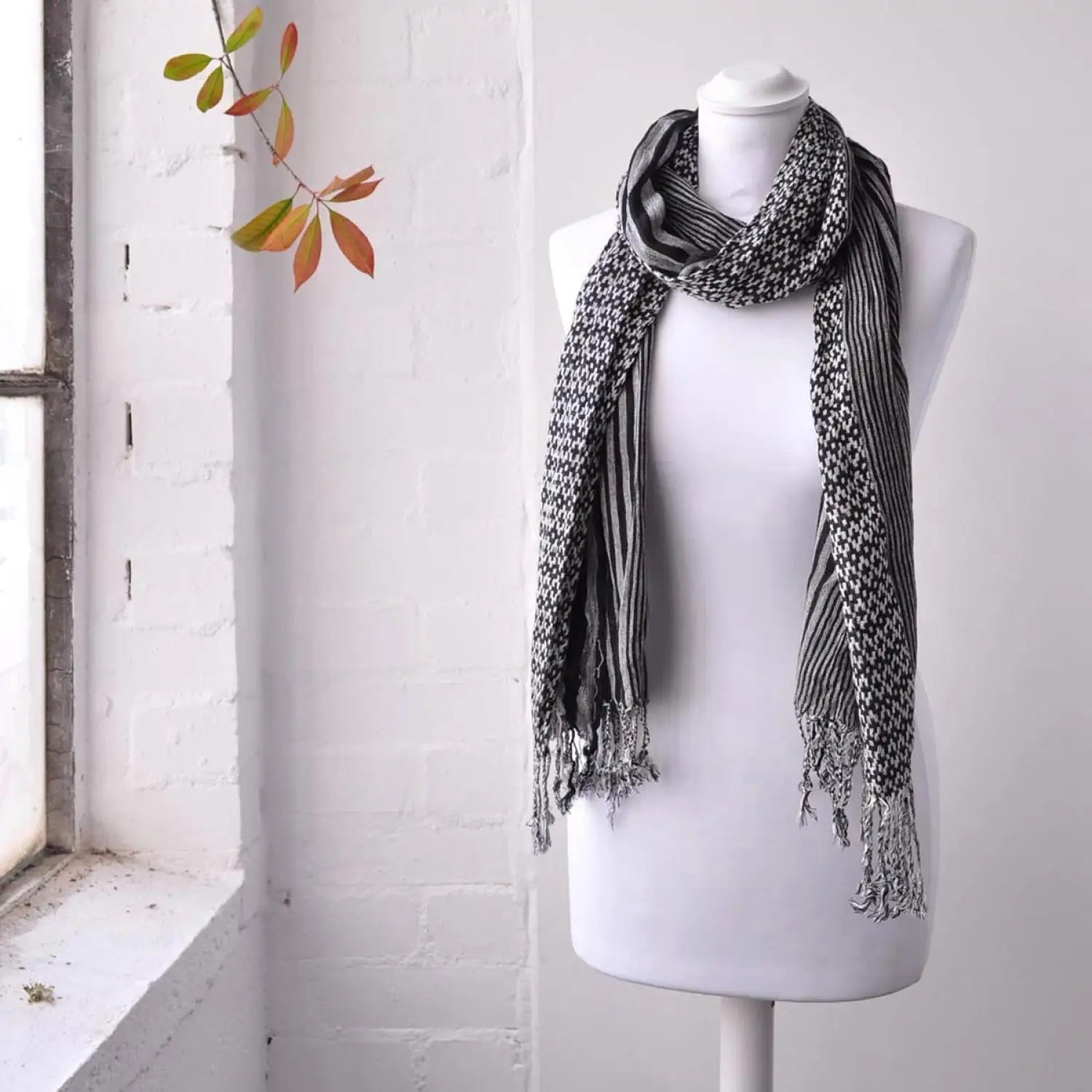 Elegant Striped Woven Winter Scarf on Mannequin
